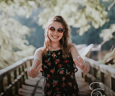 young successful woman pointing V for Victory fingers