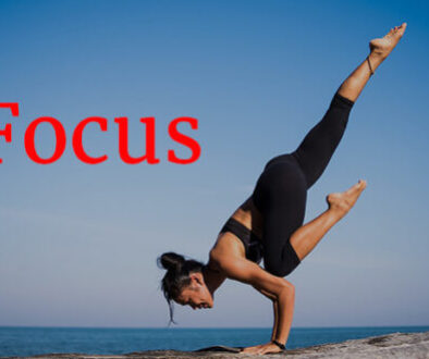 woman in yoga pose by ocean Focus concept