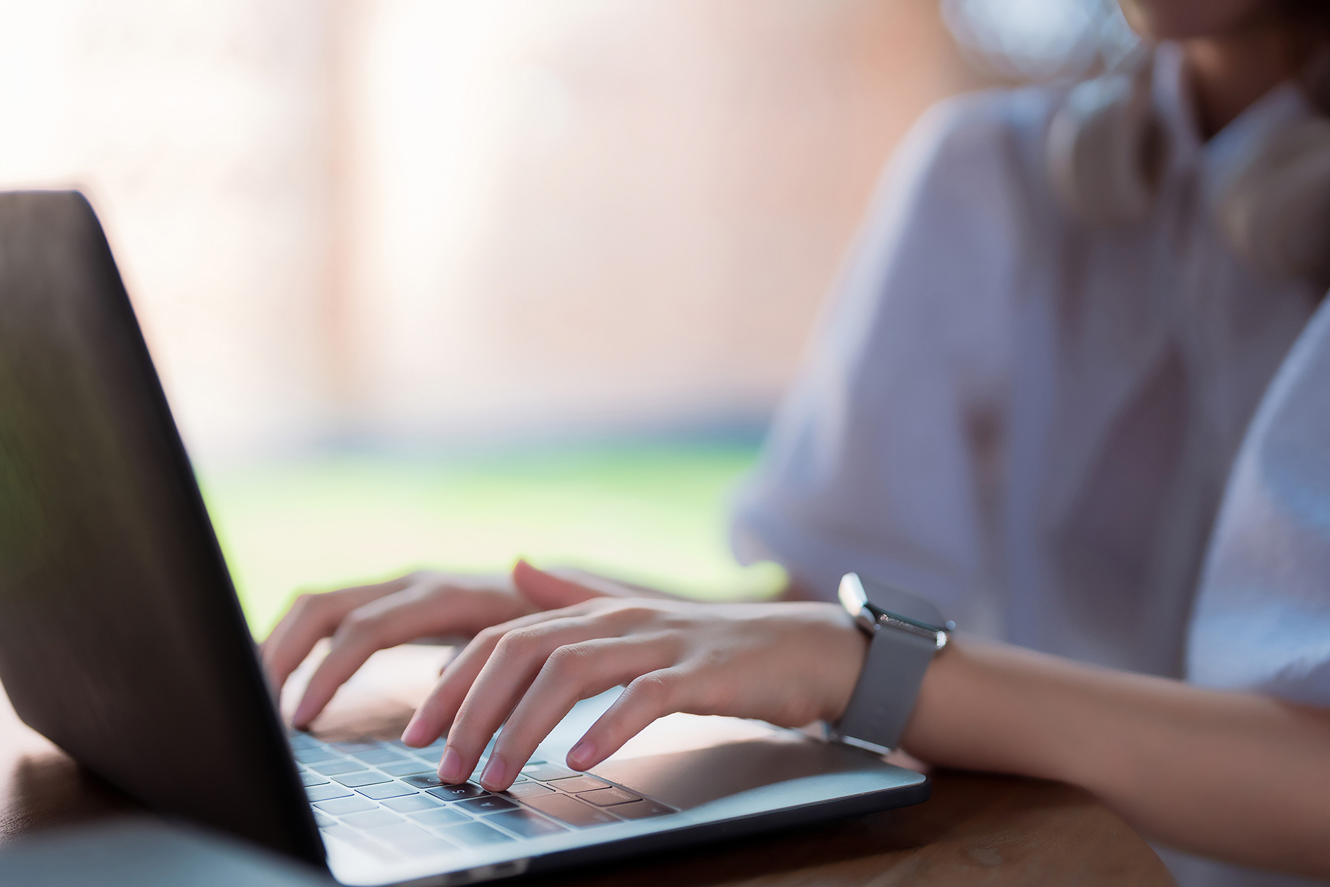 Asian adult woman typing laptop keyboard remote work online stud